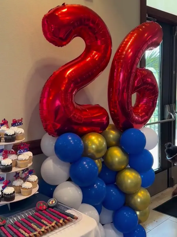 Blue, gold and white graduation balloon column with red 26 foil numbers by CAJE Creations, Tampa FL